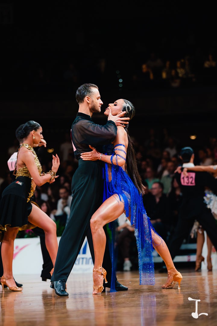 A dance couple in a close hold at a competition