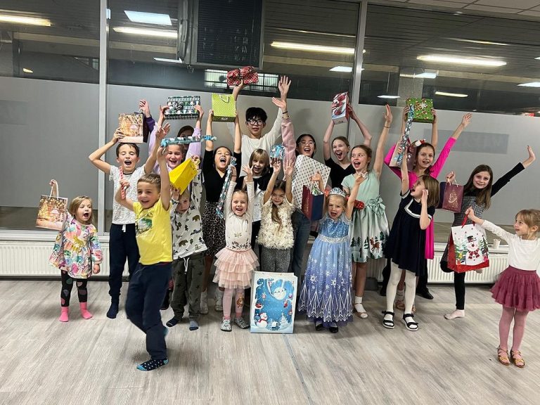 Children celebrating together after a dance event